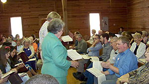 James Robert Chambless, Michael Thompson and Joyce Walton lead a song at a Sacred Harp singing, Holly Springs Primitive Baptist Church, Bremen, Georgia, June 2, 2012.