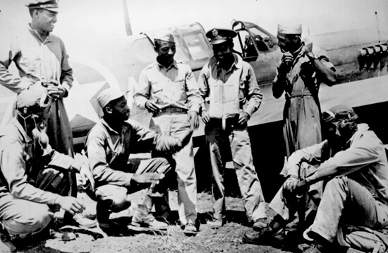 Photographer unknown, Tuskegee Airmen gathered at a U.S. base after a mission in the Mediterranean theater, February 1944. Courtesy of the United States National Archives and Records Administration.