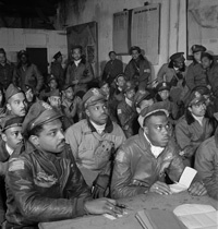 Toni Frissell, Photograph of several Tuskegee airmen attending a briefing in Ramitelli, Italy, March 1945. Courtesy of the Library of Congress.
