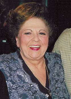 Vestal Goodman, 2001. Goodman's "style of adornment," overtly emotional and bombastic style of singing, and lyrics that resonated with the plight of many queer gospel fans, made her an icon.