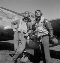 Toni Frissell, Col. Benjamin O. Davis, full-length portrait, and Edward C. Gleed, wearing flight gear, standing next to airplane, and looking upward, at air base at Ramitelli, Italy, 1945. Courtesy of the Library of Congress.
