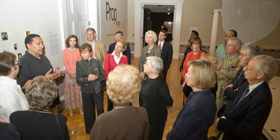 Paul Cheney, Page and Logan talk with museum visitors on Prop Master opening night, Charleston, South Carolina, April 2009.
