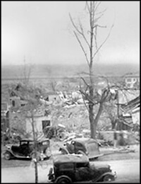 "Looking S.E. from Corner Church and Walnut Sts Tupelo Miss. Path of tornado of April 5, 1936 About 9 PM."