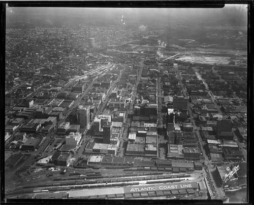 Burgert Brothers, Downtown Tampa aerial view, east from railroad sheds to Ybor, Estuary Zone, and gas storage tank Tampa, Florida, 1958. Catalog no.: PA 5858.
