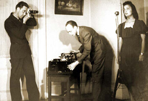Stetson Kennedy, Robert Cook (with camera) and Stetson Kennedy (with recording equipment) documenting Edith Ogden-Aguilar Kennedy, Ybor City, Florida, 1939.