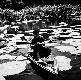 J.C. Boudreaux in his pirogue on Avery Island during filming of Louisiana Story, circa 1947.