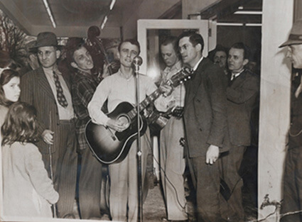 Cas Walker event with Josh Graves (guitar), Monroe Queener (dobro) and crowd