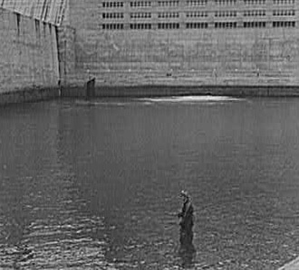 Arthur Rothstein, Man fishing at Norris Dam, TN, 1942.