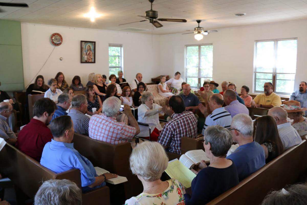 Daphene Causey of Alabaster, Alabama, leads at the 113th session of the Lookout Mountain Sacred Harp Singing Convention, Pine Grove Primitive Baptist Church, Collinsville, Alabama, August 27, 2016. Photograph by James Robert Chambless. Courtesy of the Sacred Harp Museum.