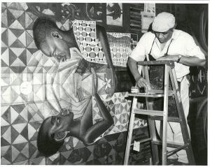 John Biggers paints House of the Turtle, Hampton University, Hampton, Virginia, ca. 1990. Photo courtesy of John Biggers's Estate. John Biggers Papers, Emory University Manuscript, Archives, and Rare Book Library.