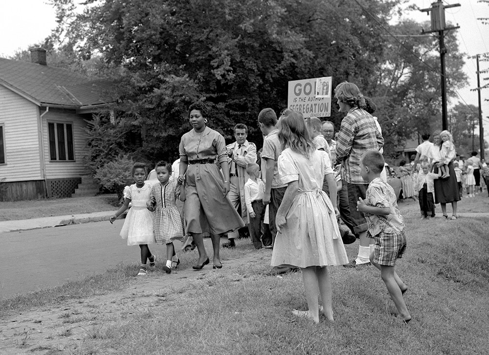 Grace McKinley takes Rita Buchanan and Linda McKinley to school among protesters, Nashville, TN, September 1957. © Nashville Public Library. Grace McKinley takes Rita Buchanan and Linda McKinley to school among protesters, Nashville, TN, September 1957. © Nashville Public Library.