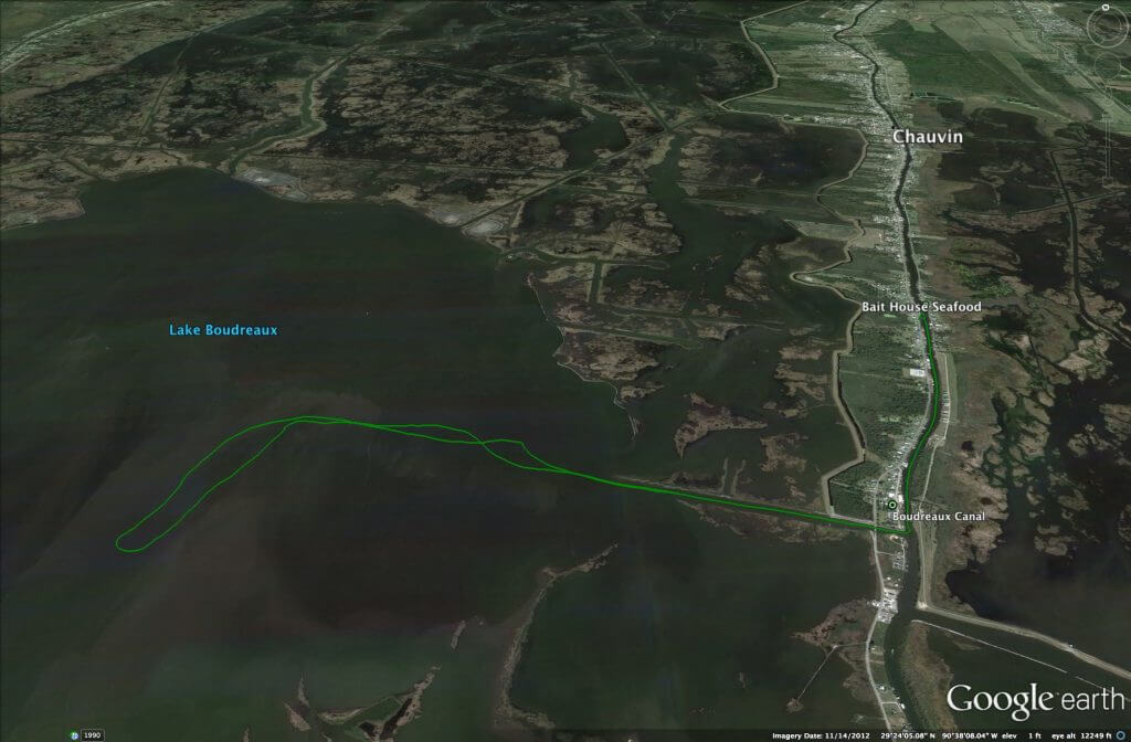 A Google Earth screenshot shows a river with buildings on either side. In the center of the image it reads "Bait House Seafood"