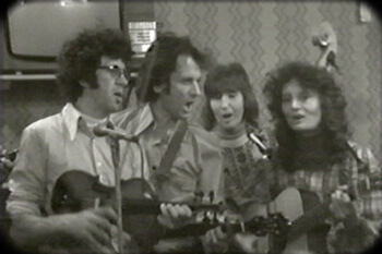 The Strange Creek Singers perform at Onllwyn Miners' Welfare Hall in Onllywyn, South Wales, 1976. Video still from Keep Your Eye upon the Scale, by Tom Hansell, Patricia Beaver, and Angela Wiley.