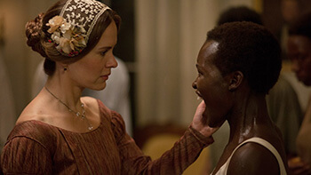 Sarah Paulson as Mistress Epps and Lupita Nyong'o as Patsey, 2013. © FoxSearchlight.