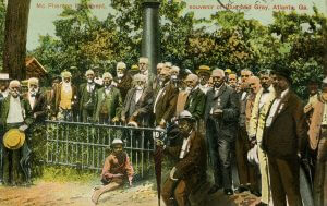 Blue-Gray reunion at the McPherson Monument, Albert Shaw, center-forward, with umbrella, July 1900. Illustration.