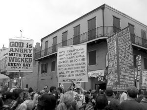 Pick Your Poison, Bible-bangers on Bourbon Street during Mardi Gras, New Orleans, February 5, 2008. Photograph by Flickr user MA1216. Creative Commons license CC BY-NC-ND 2.0.