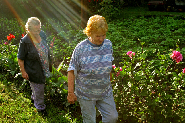 Sisters, in the glory of their garden. Letcher County, KY, 2005.