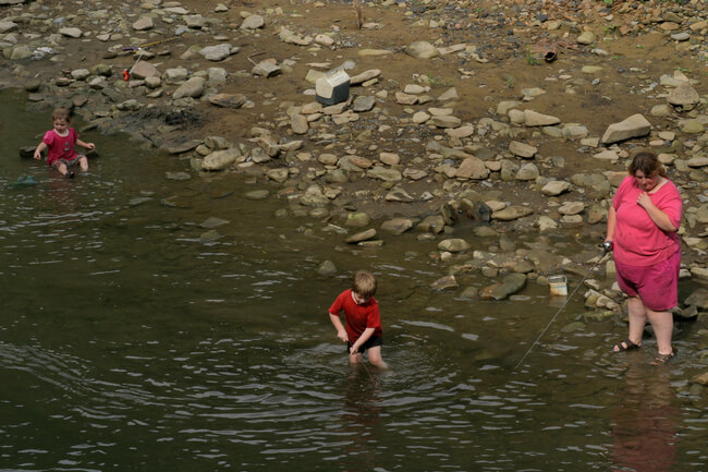 Mother fishing with her children. McDowell County, WV, 2005.