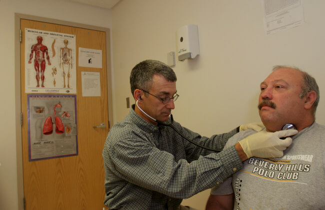 Unemployed coal miner uses the services of Free Health Clinic. He has lost his union health card and is being treated for hypertension. West Virginia ranks first in the US for this condition. Clay Primary Health Care Clinic, Clay, WV, 2005.