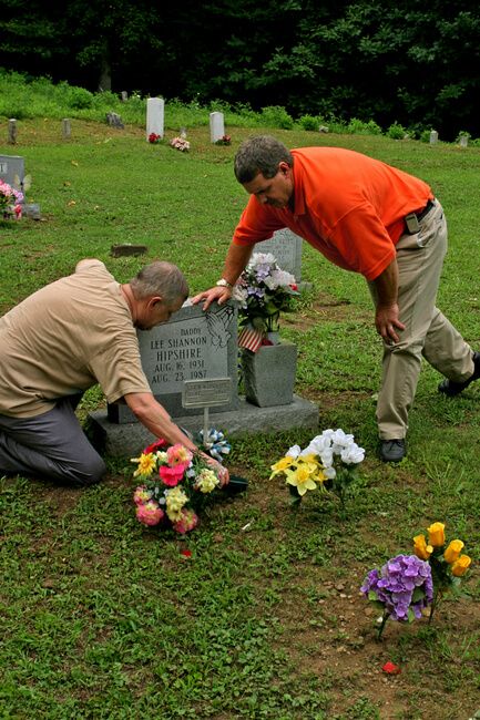 Sons attend the grave of their father, Lee Hipshire, a coal miner and black lung victim. Logan County, WV, 2005.