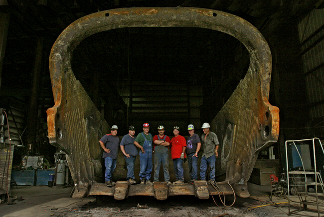 UMWA surface miners in welding shop with dragline bucket they maintain. Boone County, WV, 2005.