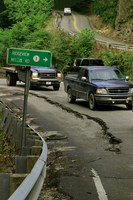 A 120,000 pound coal truck causes as much damage to roads as 37, 440 cars. Harlan County, KY, 2006.