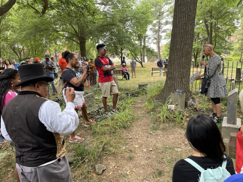 Lisa Fager addresses visitors at Nannie Headstone on Juneteenth, 2023. Photograph by Erika Berg.